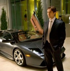 Christian Bale as Batman with his Lamborghini Murcielago 